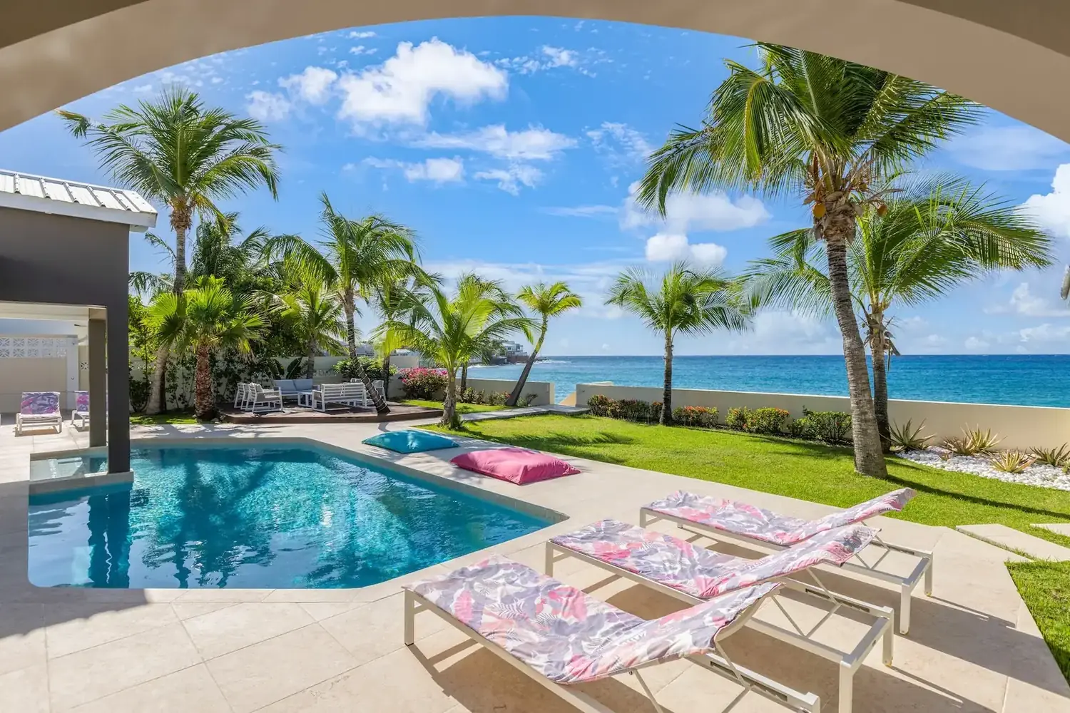 Sea-facing pool and garden at Villa Beach Secrets in Beacon Hill